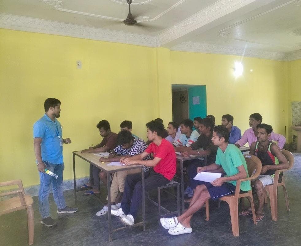 Young people learning skills together on laptops